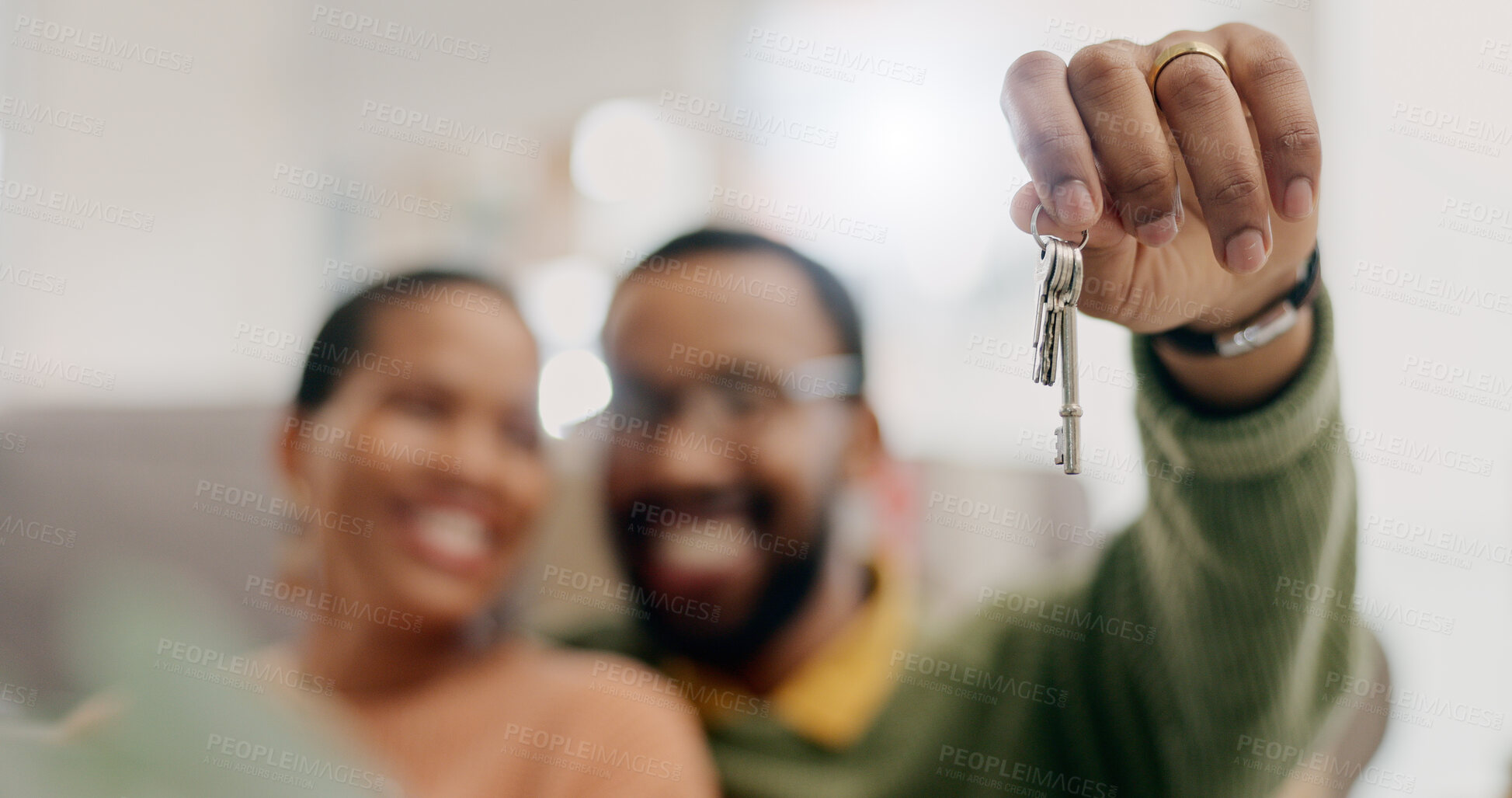 Buy stock photo Hand, keys and couple with closeup in new home for fresh start, property or real estate investment with smile. African man, woman and happy for apartment, house and mortgage  in blurred living room