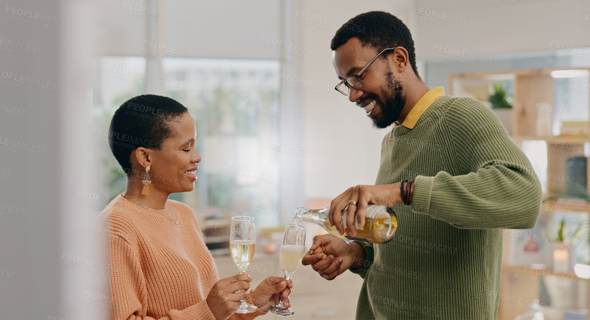 Buy stock photo Champagne glass, bottle and happy black couple pour drinks for marriage union, anniversary date or honeymoon. Romantic love, home wine or relax African man, woman or people smile for alcohol beverage