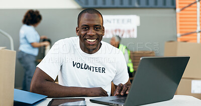 Volunteer man, laptop and portrait for donation, clothes drive and smile for community service, scroll and web. African person, pc and social responsibility with boxes, charity and ideas for helping