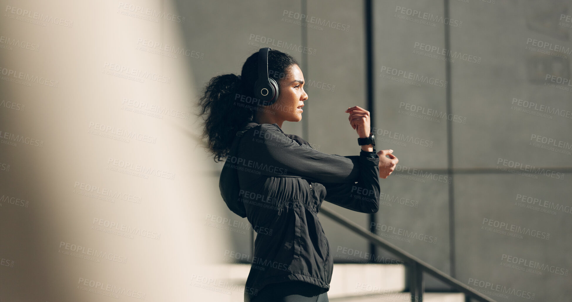 Buy stock photo Runner woman, headphones and warm up on stairs for music, vision and ideas in city, workout and training. Girl, thinking and listen on steps with streaming subscription, wellness and stretching arms