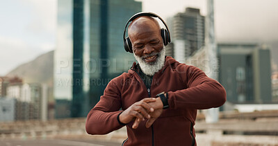 Buy stock photo Man, headphones and smart watch in city for fitness, exercise results and workout performance. Happy senior african runner check timer, clock and healthy training progress with music in urban street