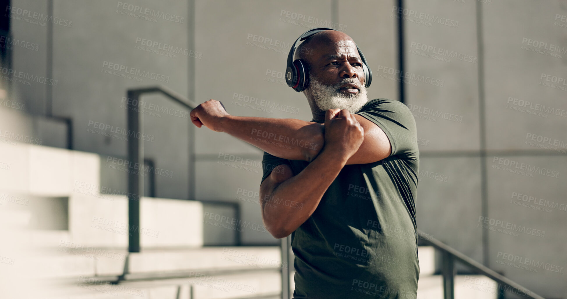 Buy stock photo Fitness, headphones and senior black man stretching in city, workout and exercise for body health. Music, serious athlete and warm up on steps or stairs in urban town, listening to audio and thinking