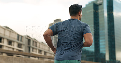 Buy stock photo Back, running and a sports man in the city for cardio training to improve fitness for a marathon. Exercise, workout or health with a young runner or athlete in an urban town for a speed challenge