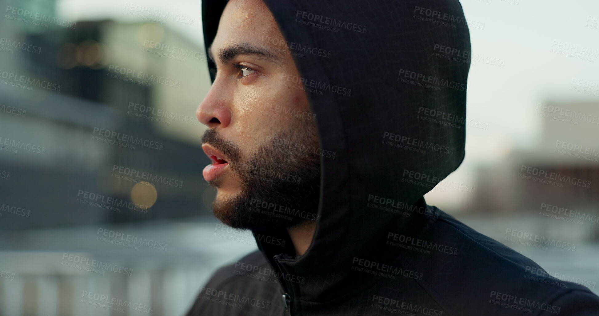 Buy stock photo Fitness, face and thinking, man in city on rest from morning workout challenge in hoodie. Relax, breathing and tired athlete on calm urban exercise with fatigue, reflection and outdoor fresh air.