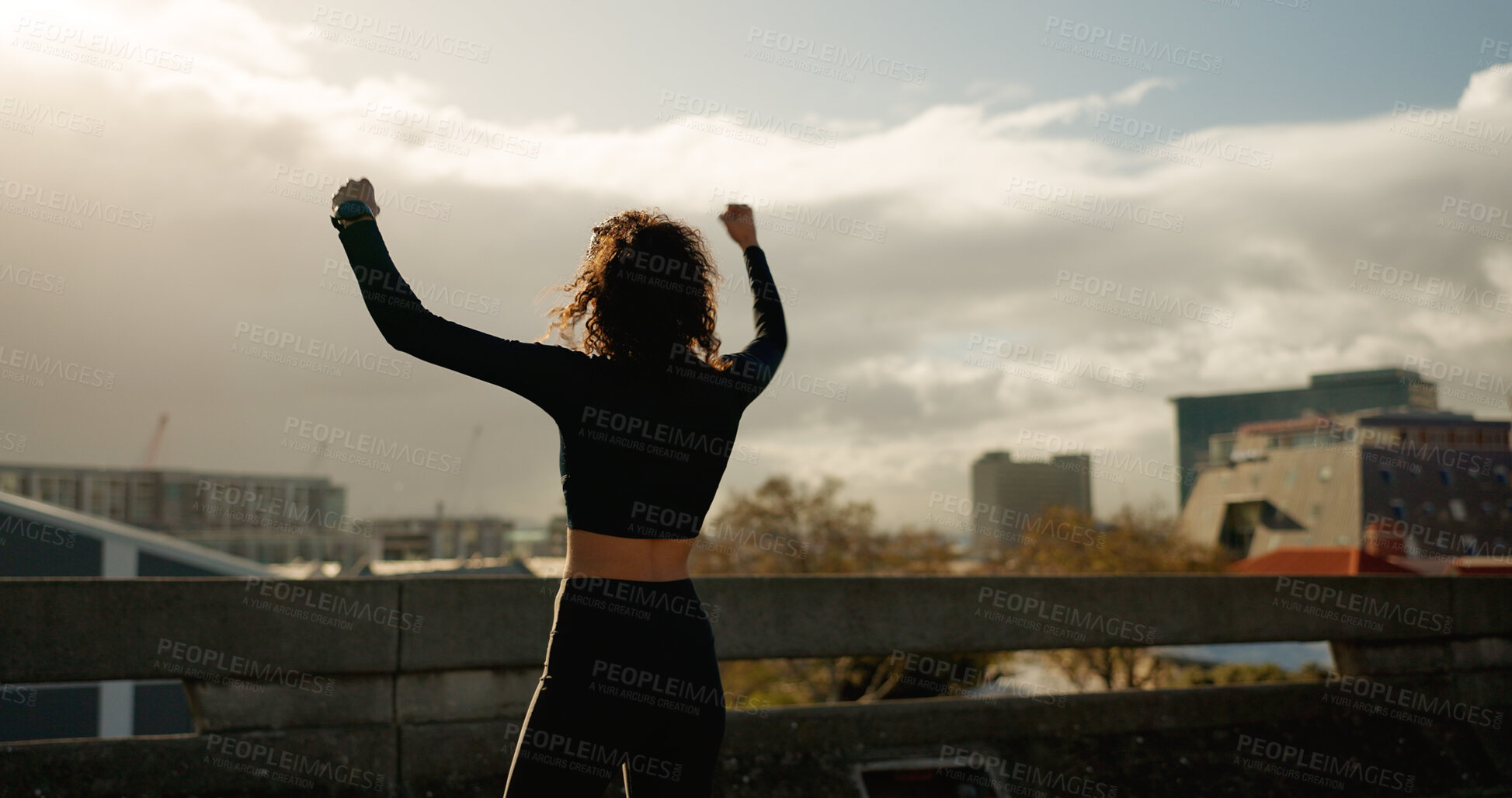 Buy stock photo Woman, freedom and winning in city for fitness achievement, workout or outdoor training success. Rear view of female person, runner or athlete in celebration for goals or victory in an urban town