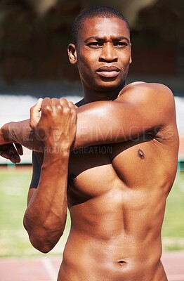 Buy stock photo Body, stretching and man runner at a stadium for fitness, training and workout, warm up and focus. Start, stretch and African male athlete at a race track for cardio, exercise and sports performance