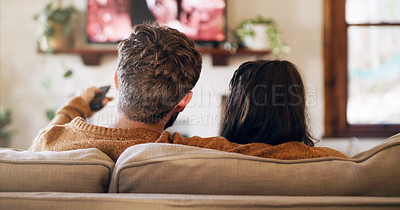 Buy stock photo Watching tv, couple and love in a home on a living room sofa with bonding feeling relax. Cuddle, lounge couch and house with a television and movie with people back streaming series with remote