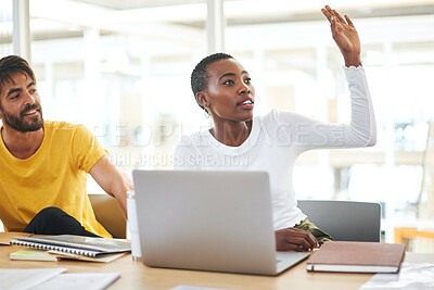 Buy stock photo Shot of a young businesswoman raising her hand to ask a question during a meeting in a modern office