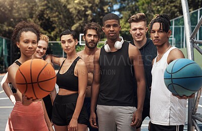 Buy stock photo Portrait of a group of sporty young people standing together on a sports court