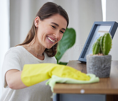 Buy stock photo Woman, smile and cleaning shelf in home, furniture and disinfection of dust, dirt or risk of bacteria. Happy girl wipe wooden surface with cloth, gloves and hygiene for safety, germs or care in house