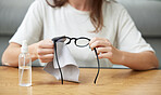 Woman, hands and clean glasses from dirt or seeing health, microfiber cloth for lenses. Female person, wipe frame and spectacles for bacteria for clear vision with tissue for reading, safety for eyes