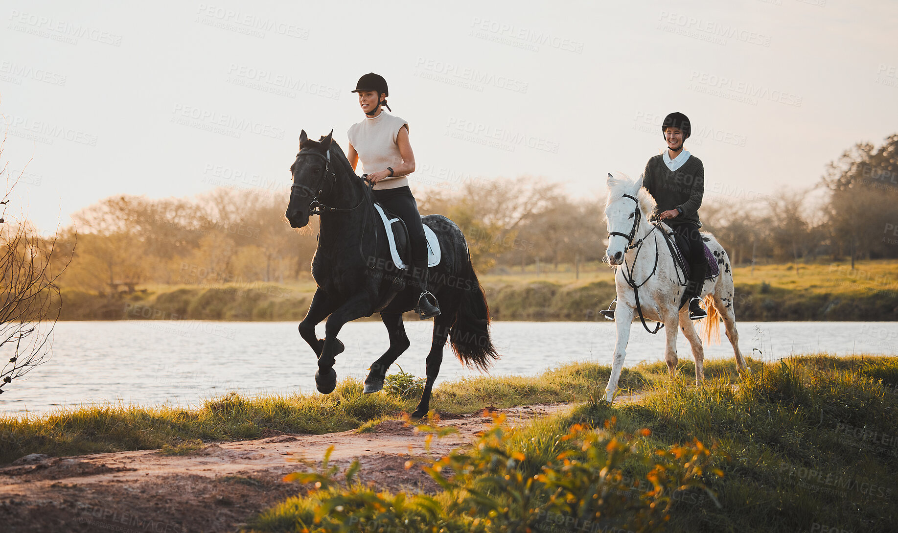 Buy stock photo Horse riding, freedom and hobby with friends in nature on horseback by the lake during a summer morning. Countryside, equestrian and female riders outdoor together for travel, fun or adventure