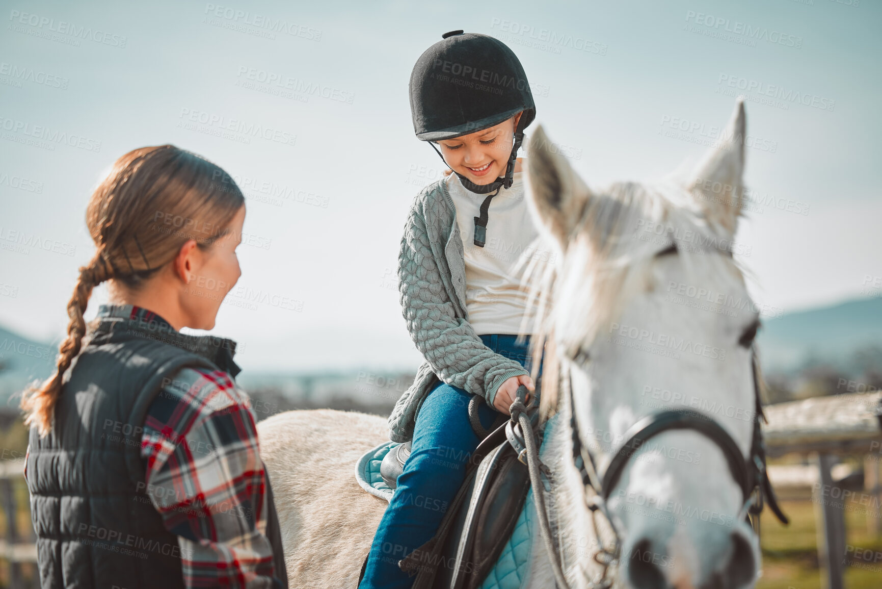 Buy stock photo Learning, hobby and girl on a horse with a woman for fun activity in the countryside of Italy. Happy, animal and teacher teaching a child horseback riding on a field as an equestrian sport in nature