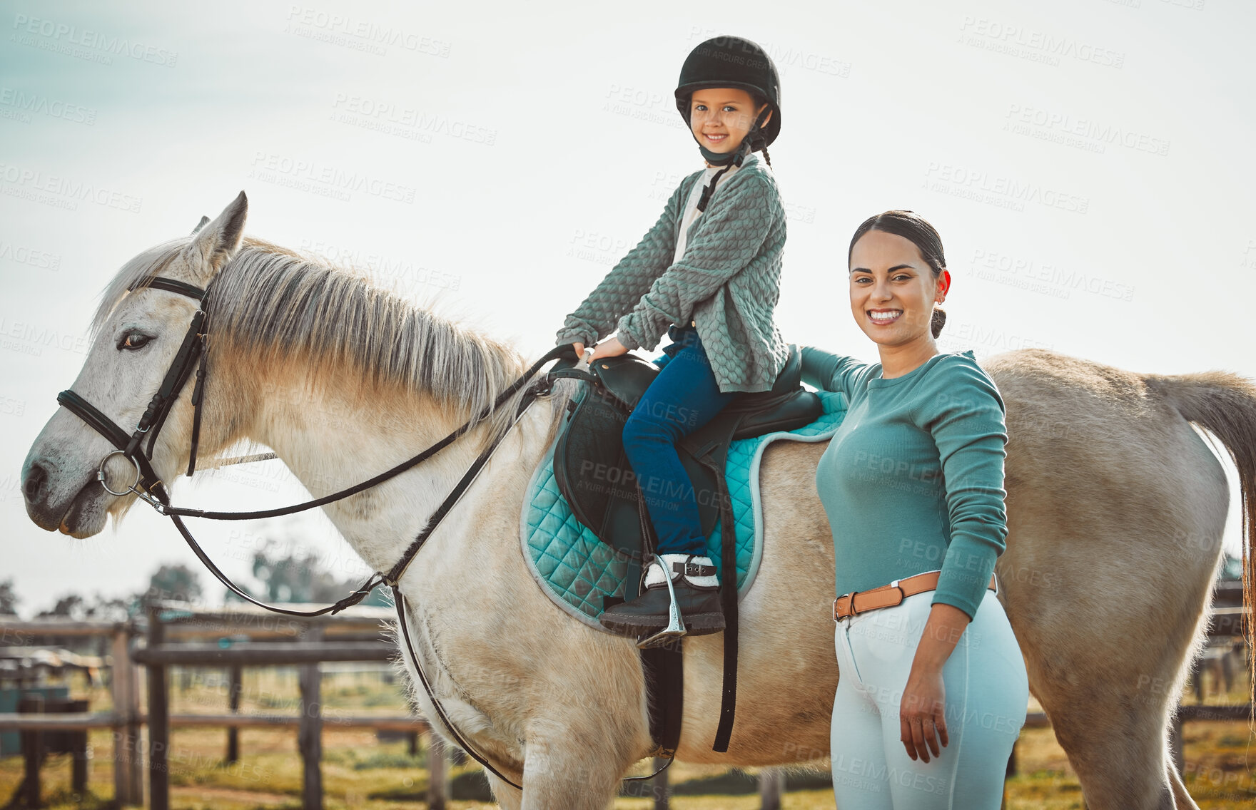 Buy stock photo Portrait of woman standing, child on horse and ranch lifestyle with smile and equestrian sports on field. Countryside, rural nature and farm animals, mother teaching girl to ride stallion in USA.