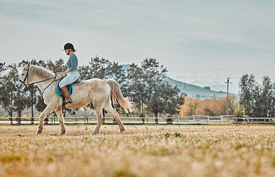 Buy stock photo Exercise, woman riding horse and training for competition, hobby and outdoor with passion for sports. Workout, female and athlete with pet, ranch and outside for practice, fun and on summer vacation