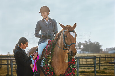 Buy stock photo Woman, horse and winner of equestrian competition with ribbon award for sports achievement. Athlete person on animal for horseback riding, race and training for badge prize with pride in countryside