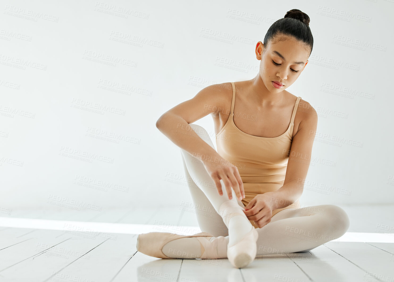 Buy stock photo Woman, ballet shoes and tie ribbons for performance, dancer and prepare in dance studio. Female person, ballerina and ready for practice, competition and recital, artist and art academy or school