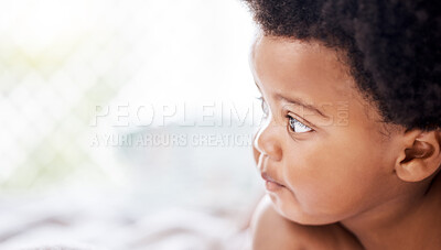 Buy stock photo Face, toddler and looking with curiosity in home for child, cognitive and development for milestone. African, little boy and afro with growth in health, wellness and hope for future in living room