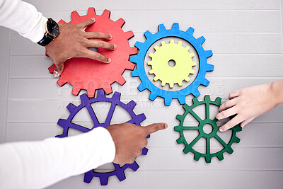 Buy stock photo Closeup, business and teamwork with gears, problem solving and collaboration with engineering, research and ideas. Brainstorming, hands and professional with planning, development and partnership