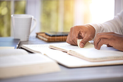 Buy stock photo Hands, closeup and bible study at desk, home and reading for faith, knowledge or spiritual guide. Person, notebook and religion books on table for worship, peace or connection to holy spirit in house