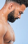 Shower, cleaning profile and relax man with shampoo and calm from water, skincare and morning routine. Bathroom, cosmetics and male model in studio with blue background and dermatology for wellness