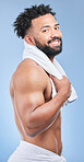 Bath towel, portrait and happy man shower, grooming and morning routine, beauty cleaning or self care maintenance. Bathroom skincare, spa gym sauna and strong studio person hygiene on blue background