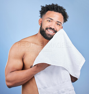 Buy stock photo Shower towel, studio portrait and happy man after morning routine, body cleaning treatment or facial self care. Bathroom, grooming and model hygiene, wellness and dry skin isolated on blue background