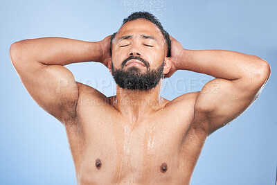 Buy stock photo Bath water, shower and man wet, grooming and morning self care maintenance, bathroom body cleaning or spa salon wellness. Skincare liquid wash, eyes closed or studio person hygiene on blue background