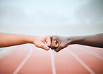 People, hands and fist bump outdoor for sport, running and fitness motivation or partnership for race. Friends, athlete or diversity on field, training or exercise with team building, deal and unity