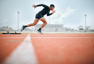 Buy stock photo Man, athlete and ready for race on track with practice, training or exercise for competition. Black person, runner and fast with dedication, determination and passion on face with speed for sport