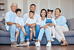 Portrait, home and family on a couch, relax and cheerful with love, weekend break and generations. Grandparents, mother or father with children, kids and rest with joy, calm and happiness in a lounge