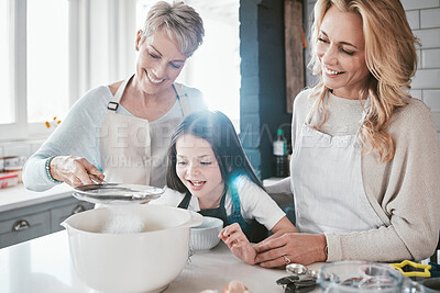Buy stock photo Family, children and baking with a grandmother, mother and daughter in the kitchen together for learning. Food, cooking and kids with a woman, parent and girl bonding in the house to bake a pastry