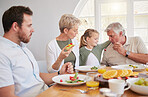 Dinner, children and breakfast in big family home, eating or talk for help, dad or grandparents at table. Men, women and kid for food, lunch or brunch for memory, conversation or smile in dining room