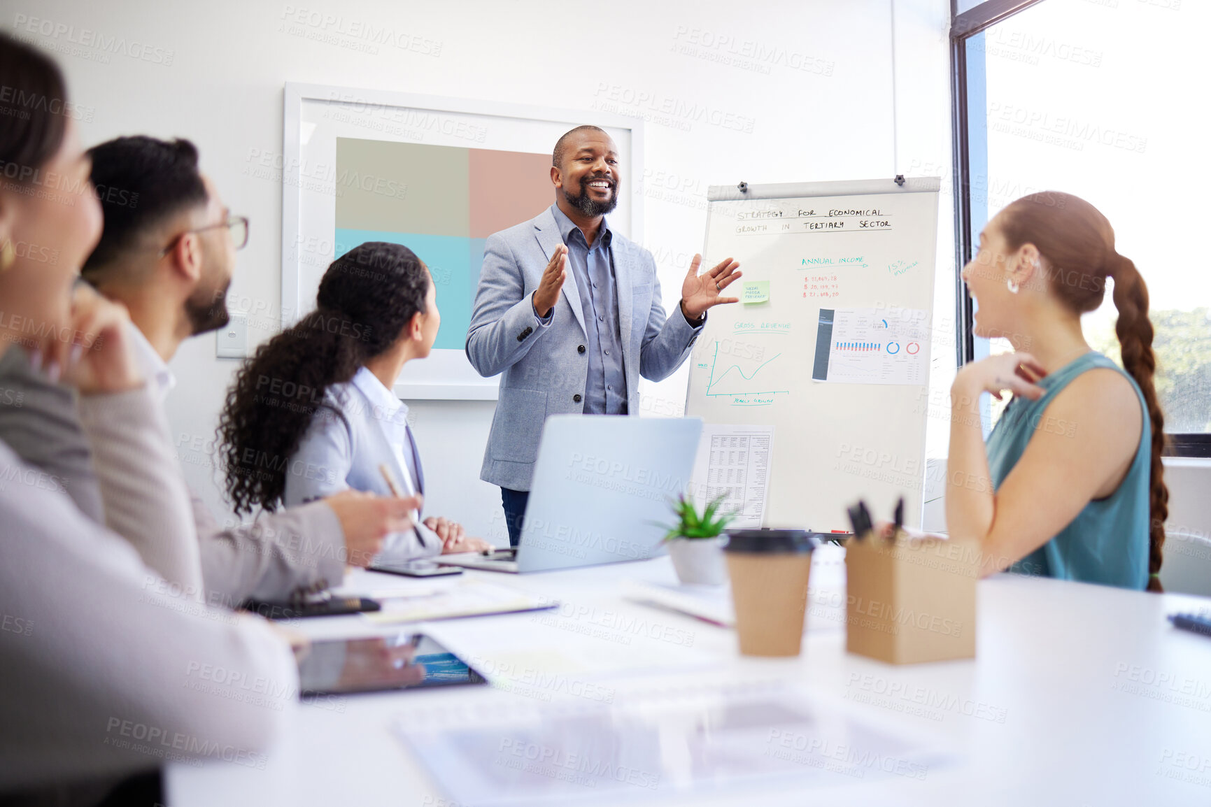 Buy stock photo Development, training and presentation with black man in meeting for strategy and progress in startup. Business growth, coach and businessman teaching staff about planning, profit or economy analysis