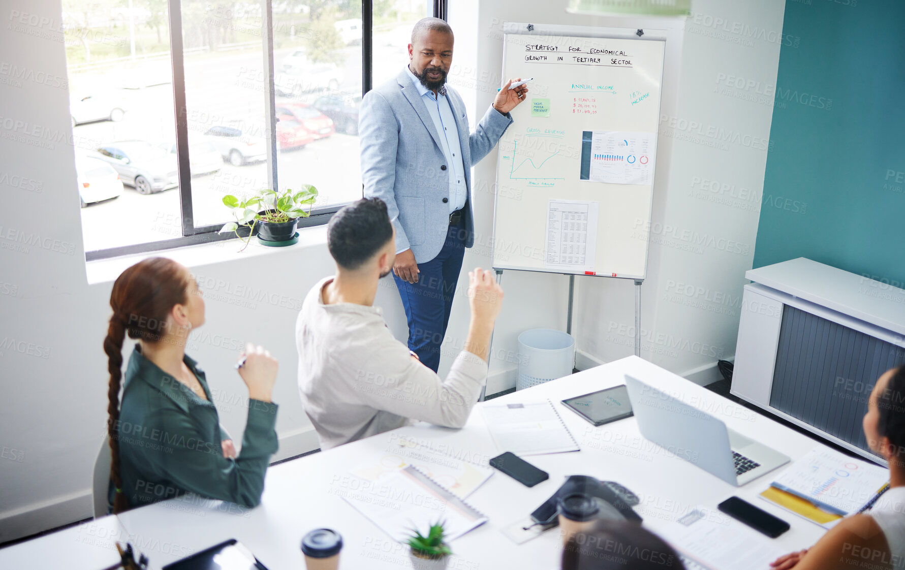 Buy stock photo Coach, training and black man with presentation in meeting for strategy and progress in startup. Teaching, business growth and boss planning with staff for profit in economy with analysis or numbers
