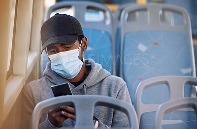 Buy stock photo Man in bus with mask, phone and morning travel in city, checking service schedule or social media post. Public transport safety in covid, urban commute and person in seat with smartphone connection.