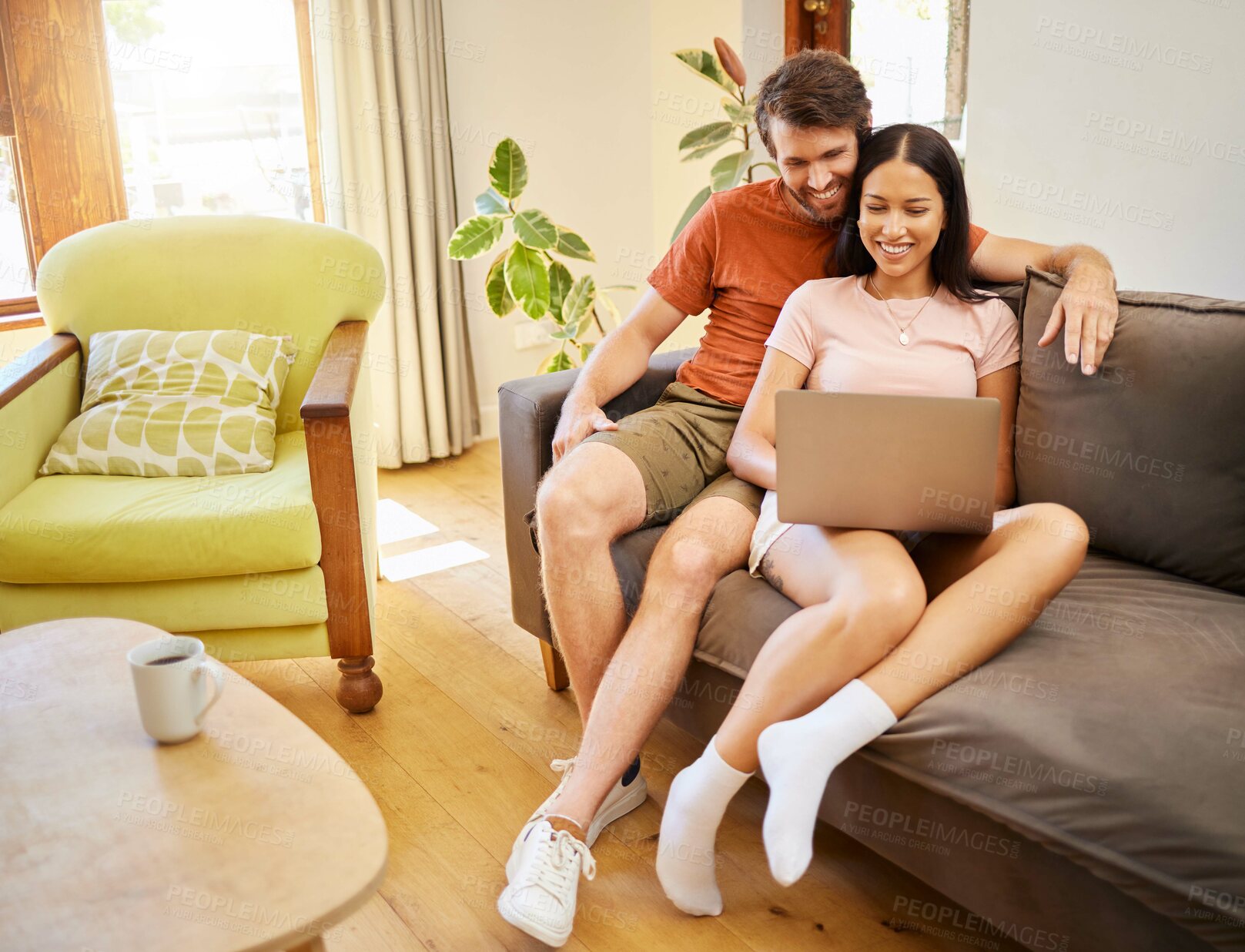 Buy stock photo Relax, love and laptop with a young couple surfing the internet with wireless technology on the sofa in the living room at home. Weekend, bonding and learning together in a house over the weekend