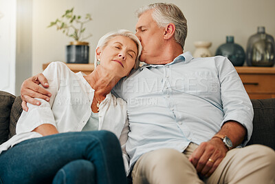 Buy stock photo Retirement couple, love and kiss on sofa lounge, relax and living room lifestyle together in Australia home. Elderly, senior and pensioner man, woman and peaceful people, calm and care relationship
