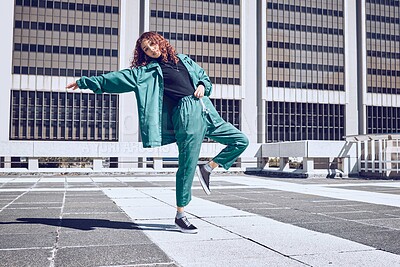 Buy stock photo Dance, music and freedom with a black woman in the city on a rooftop for dancing or fun in the day. Fashion, street and portrait with a young female dancing having fun in an urban town alone