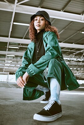 Buy stock photo Fashion, beauty and black woman pose in parking lot with trendy, stylish and modern outfit. Portrait of girl with contemporary, edgy and urban style on floor of car park or garage in designer clothes