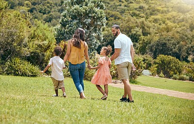 Buy stock photo Family, kids and walking in the park for bonding, fun and care in summer outside. Mother, father and parents playfully walk with children, son and daughter siblings in a garden for bond 
