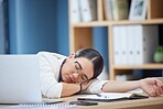 Burnout, sleeping and tired business woman in office after working overtime or overwork. Rest, relax and exhausted sleepy female employee taking nap by table after all night work on project deadline
