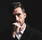 Man, idea and thinking face, fashion and portrait against a black studio back with mockup space. Male model, style and elegant clothes, young and confidence with beard, attractive or fashionable coat