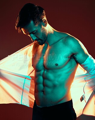 Buy stock photo Man, tattoo and shirtless body in studio with fitness, health and beauty with light, glow and sexy. Model, six pack and body art ink for healthy skin, cosmetics and fashion while trendy, edgy or hot