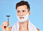 Man, shave and face for beard in studio with razor, thinking and cosmetics for self care, beauty and foam. Grooming, facial health and skincare with shaving cream, blade and contemplating in bathroom