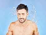 Water splash, shower and man cleaning, skincare and. washing body, face and beauty in blue stuck mockup background. Male model, clean, and hygiene care, fresh and wash skin for health and wellness