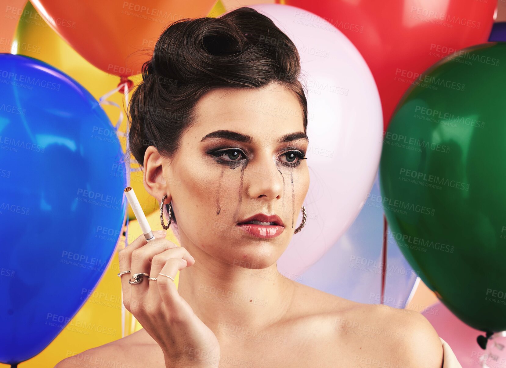 Buy stock photo Party balloon and makeup woman crying with sad, depressed and disappointed tears on face. Thinking, depression and mental health problem of girl at event smoking cigarette with sadness.