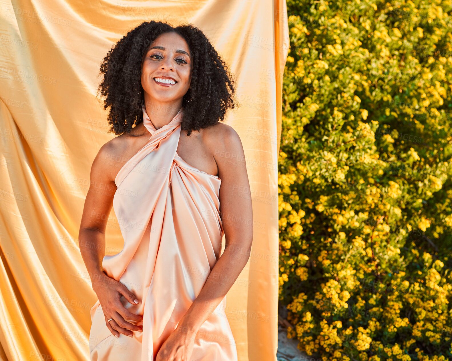 Buy stock photo Beauty, fashion and portrait of black woman in garden on outdoor shoot with silk fabric backdrop and plants in summer sun. Elegance, glamour and happy woman with afro, smile and nature in background.
