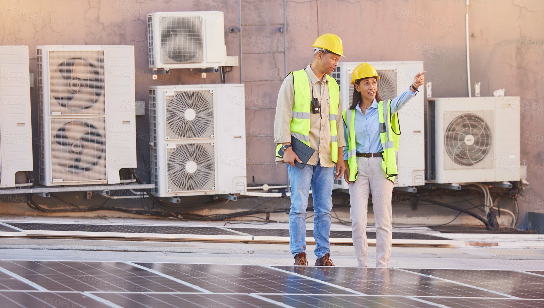 Buy stock photo Solar panels, roof or engineering team planning photovoltaic construction for renewable energy development. Solar energy, innovation or engineers working on an industrial building or grid project