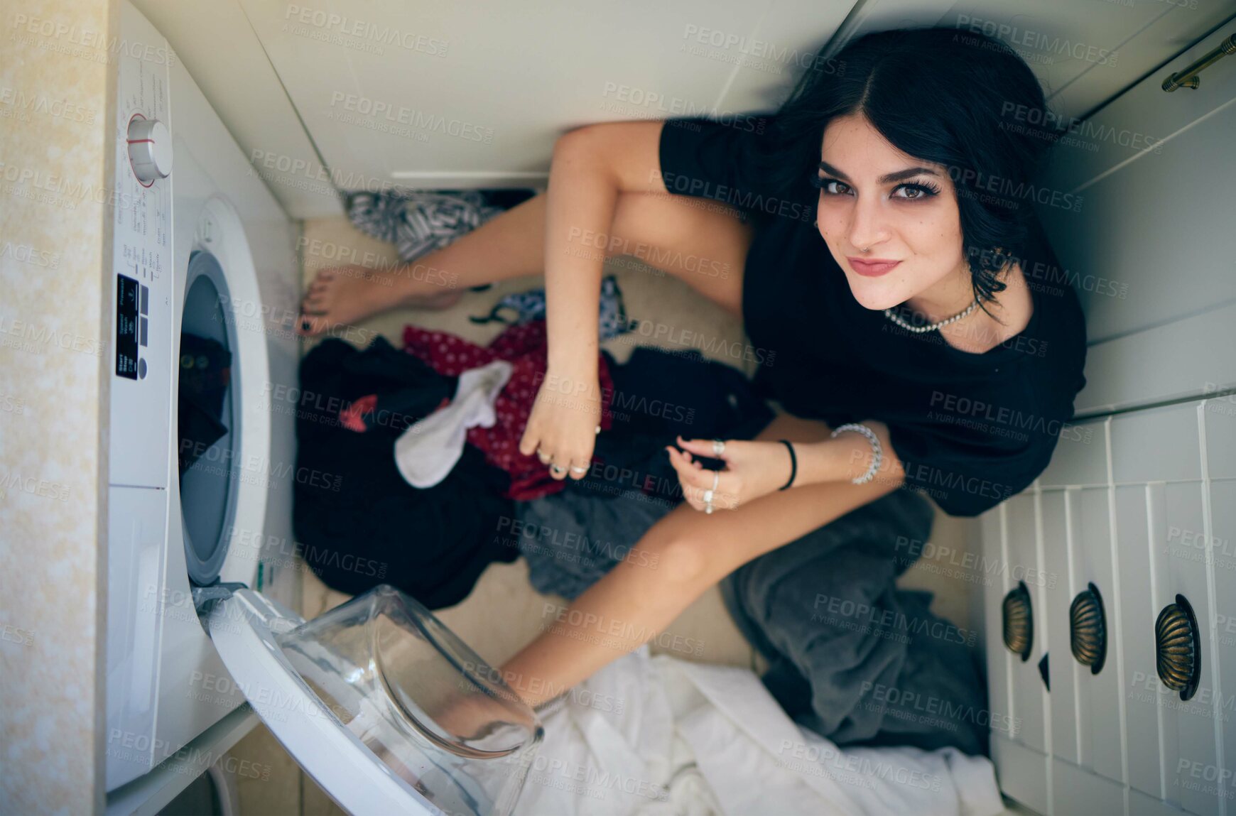 Buy stock photo Top view, laundry cleaning and woman by washing machine in home getting ready to wash clothing. Spring cleaning, hygiene and portrait of happy female sitting on floor preparing for housework alone.